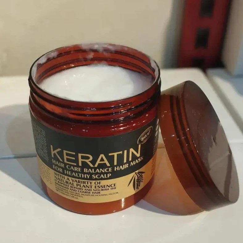 Keratin hair care balance hair mask jar with open lid on a white surface