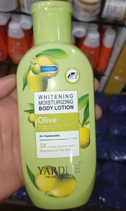 Body lotion bottle with olive oil label in a store setting